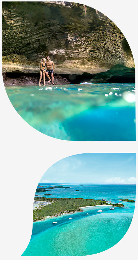 Snorkeler in clear water beside limestone and reef habitat in the Exumas